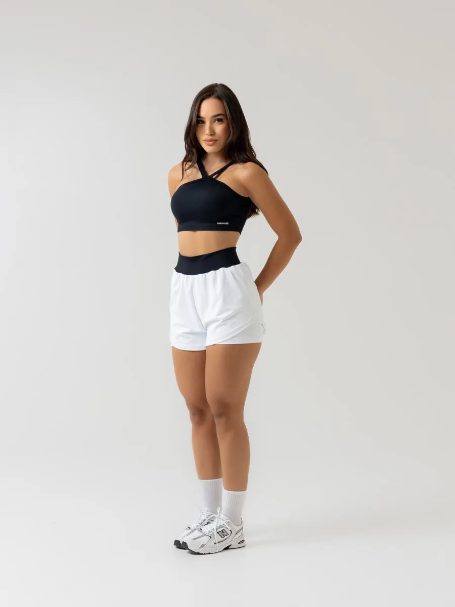 Peça fitness — top preto e shorts branco